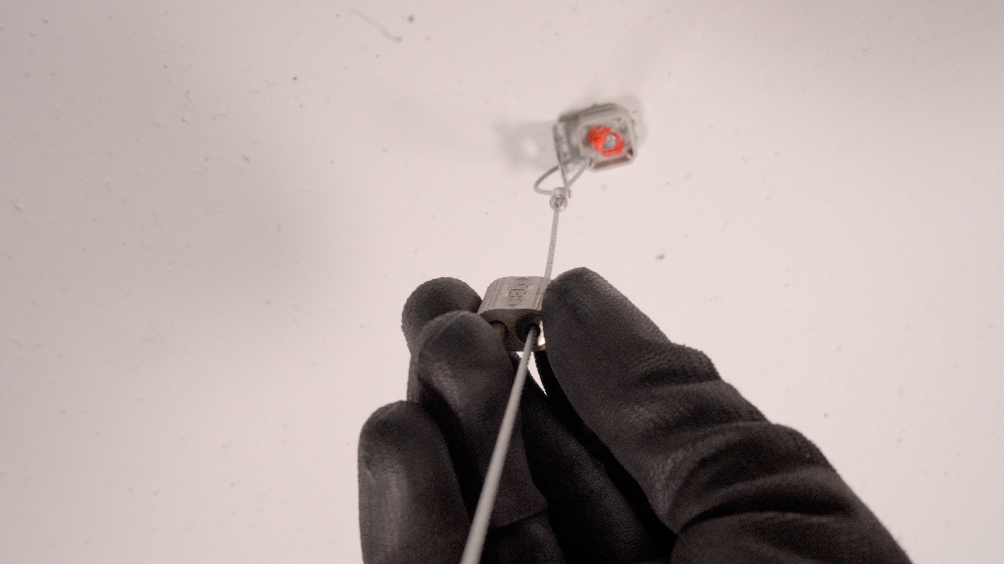 An AWFS being fixed to a ceiling with an XHA nail shot from the FORCE ONE+